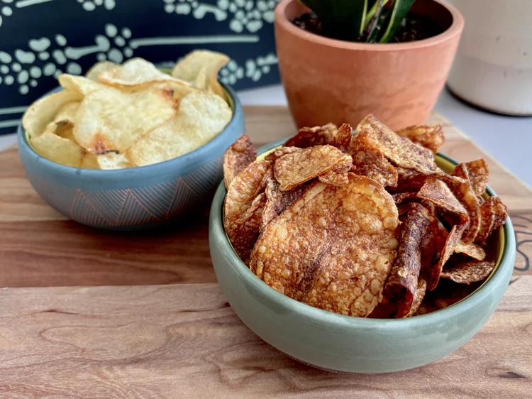 Two bowls of potato chips: Utz Dark Russets and Utz Salt and Malt Vinegar.