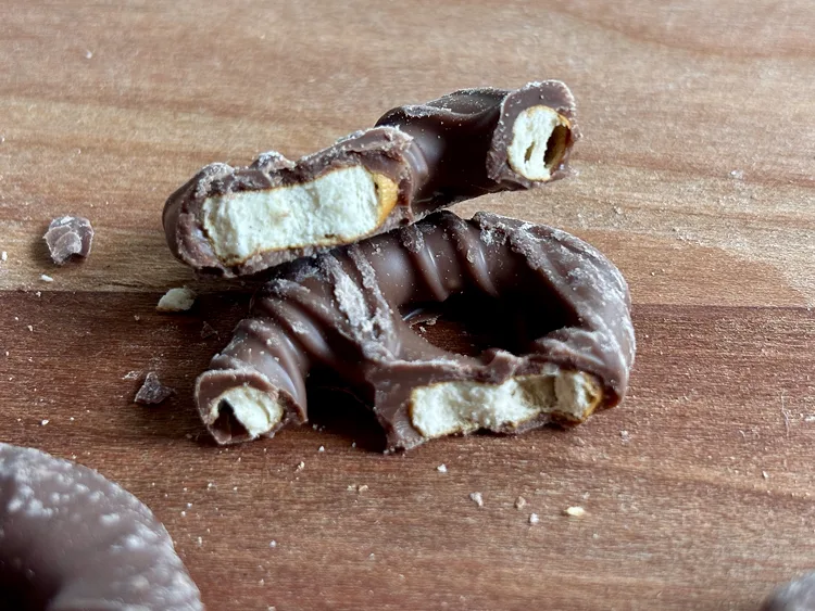 Broken pieces of Trader Joe's Milk Chocolate Covered Mini Pretzels